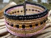 armband glaskraaltjes roze/zwart/geel 