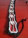 riem zwart/rood met schelpen 