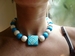 ketting houten kralen turquoise/wit
